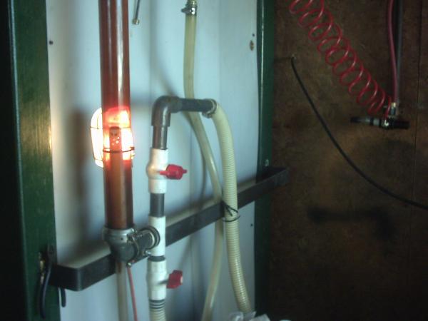 clean golden biodiesel flowing from vacuum reactor