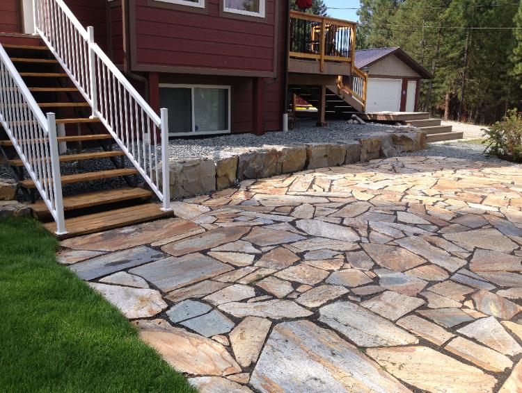 retaining wall with quartzite patio.